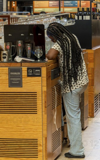 The Mercadeo da Ribeira, also known as TimeOut Market, is the best address for Portuguese specialties and international cuisine. Historic market hall at Cais do Sodré station, Lisbon, Portugal