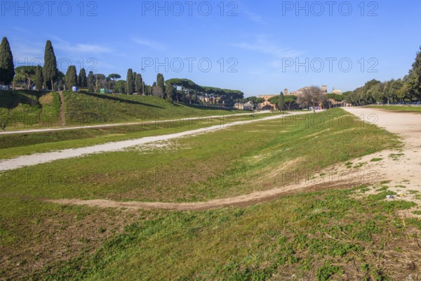 View along today green embankment former spina central element of in Circus Maximus venue of chariot races towards ancient southeast bend and former start area, Rome, Lazio, Italy