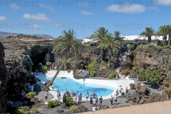 View from elevated position of pool designed by César Manrique Swimming pool in art venue cultural center tourist attraction Jameos del Agua, Punta Mujeres, Lanzarote, Canary Islands, Spain