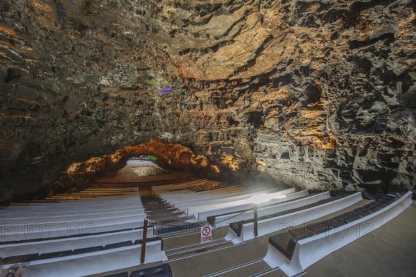 Los Jameos concert hall designed by César Manrique as a tourist attraction in lava cave of cave system in Jameos del Agua cultural center, lava tunnel in the background, Punta Mujeres, Lanzarote, Canary Islands, Spain