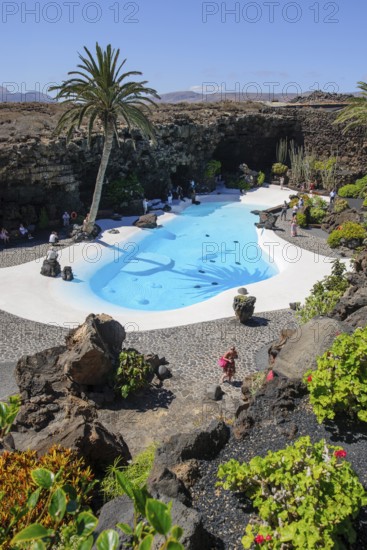 View from elevated position of pool designed by César Manrique Swimming pool in art venue cultural center tourist attraction Jameos del Agua, Punta Mujeres, Lanzarote, Canary Islands, Spain