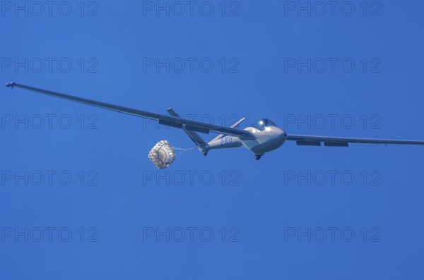 A Hänle H-101 somersault glider, registration D-3033, during a demonstration as part of an air show at the Fliegerbergfest of the Rossfeld Luftsportverein in Metzingen-Glems, Baden-Württemberg, Germany, for editorial use only