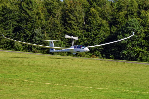 A Schempp-Hirth Arcus E motor glider, registration D-KWKU, during a screening as part of an air show at the Fliegerbergfest of the Rossfeld Luftsportverein in Metzingen-Glems, Baden-Württemberg, Germany, for editorial use only