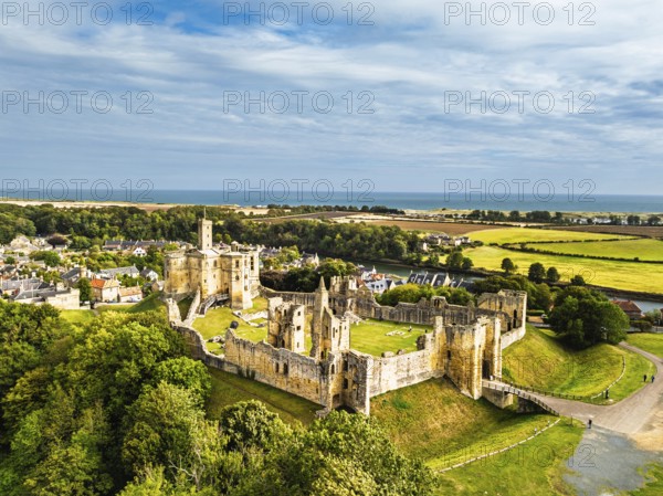 Warkworth Castle over River Coquet from a drone, Warkworth, Northumberland, England, United Kingdom