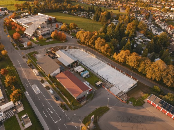 Aerial view of a commercial area in autumn with colorful trees, Calw, Black Forest, Germany