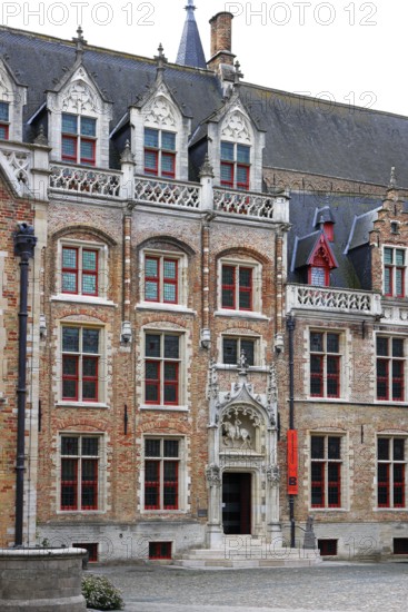 Gruuthusemuseum with equestrian statue of Lodewijk van Gruuthuse above the entrance portal in the historic old town of Bruges, UNESCO World Heritage Site, Flanders, Belgium
