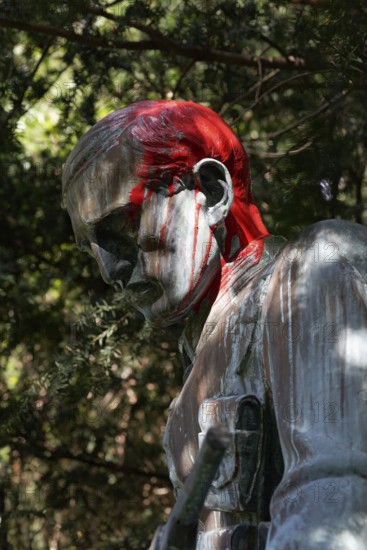 Colonial War Memorial, head sprayed with red paint, in commemoration of the Herero and Nama genocide in German Southwest Africa, Düsseldorf, North Rhine-Westphalia, Germany