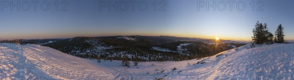 View from Mount Lusen over the hills of the bavarian forest at sunrise in winter, Bavaria, Germany