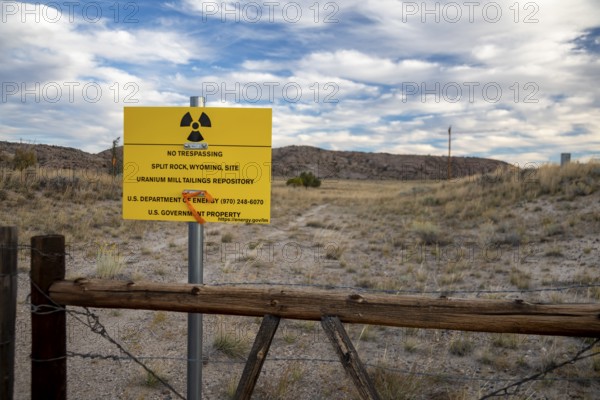 Jeffrey City, Wyoming - 'No Trespassing' signs adorn the perimeter of a former uranium mine and mill which operated from 1957 until 1981. Uranium tailings and other radioactive debris have been buried and the site is now under the care of the Department of Energy