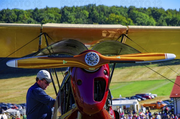 Maintenance work on a vintage aircraft at the Rossfeld Luftsportverein 2012 on Rossfeld in Metzingen-Glems, Baden-Württemberg, Germany, for editorial use only