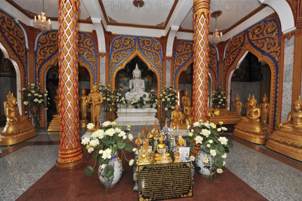 Worship room prayer room with altar Buddha statues of Buddha in temple complex Wat Chalong pilgrimage site, Wat Chaithararam, Phuket province, Phuket island, Thailand