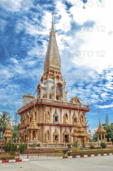 Pagoda with high point pointed tower in Wat Chalong pilgrimage site, Wat Chaithararam, Phuket province, Phuket island, Thailand