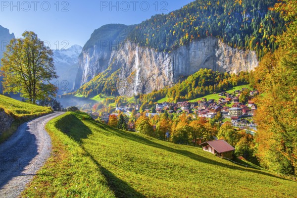 View of town and valley with Staubbach waterfall in autumn, Lauterbrunnen, Bernese Oberland, Canton of Bern, Switzerland