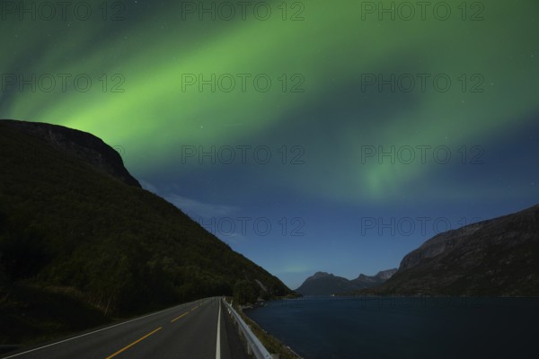 Tysfjord near Stetind Mountain in northern Norway under auroras and full moon