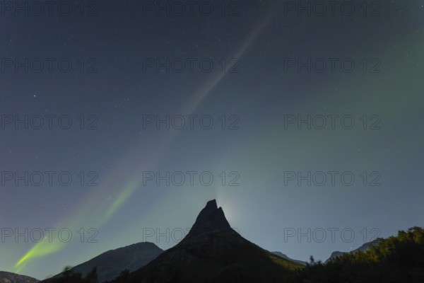 National mountain of Norway - Stetind in the Nordland under auroras and a full moon