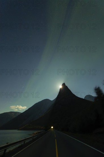 National mountain of Norway - Stetind in the Nordland under auroras and a full moon