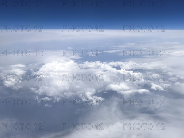 View from airplane of white bright cluster clouds Cirrus cirrus clouds, international
