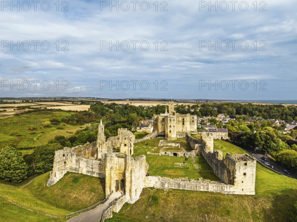 Warkworth Castle over River Coquet from a drone, Warkworth, Northumberland, England, United Kingdom