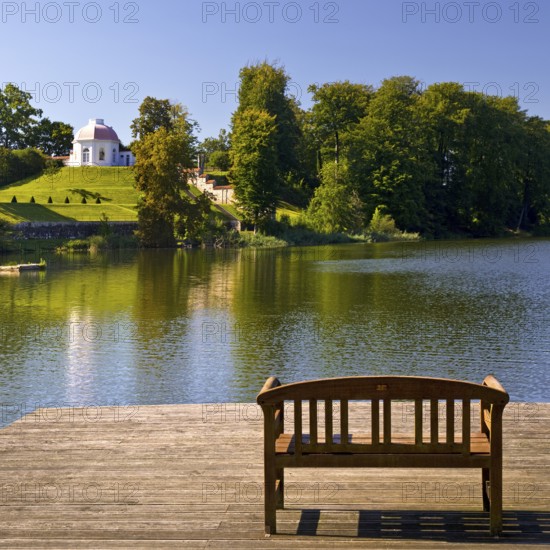 Footbridge with bench to Huwenowsee at Meseberg Castle Park, guest house and conference venue of the Federal Government, Gransee, Brandenburg, Germany