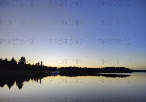 Atmospheric evening mood over Lake Grienerick, Rheinsberg, Brandenburg, Germany