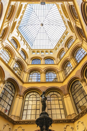 Donaunix fountain and glass dome in Palais Ferstel, Vienna, Austria