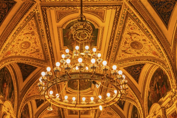 Sumptuous room and chandelier in the Vienna State Opera, Vienna, Austria