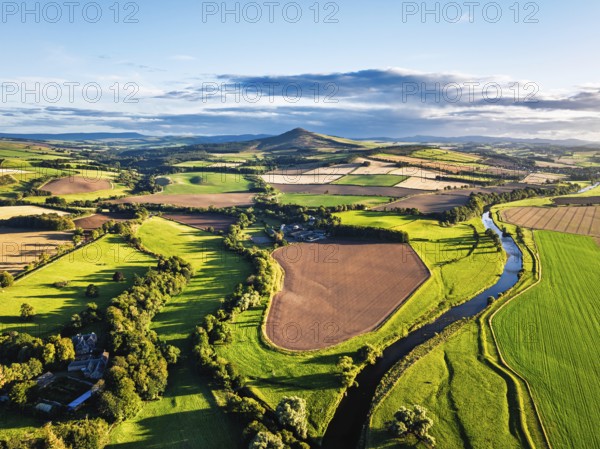 Fields and Farms over River Teviot and Minto Crags from a drone, Roxburghshire, Scottish Borders, Scotland, UK