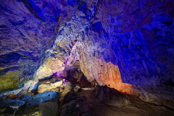 Coloured lighting, fog cave, stalactite cave in the Swabian Jura, stalactites, stalactite forest, interior view, Lichtenstein, Baden-Württemberg, Germany
