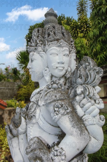 Buddha statue with four faces, four face Buddha. Brahma Vihara Brahmavihara Arama Buddhist Monastery, Banjar, Bali, Indonesia
