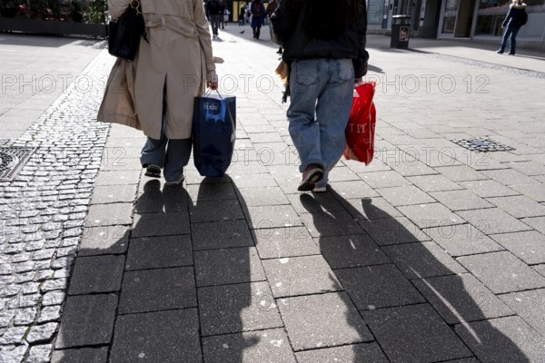 Shadows of passers-by shopping in the city center, Essen, North Rhine-Westphalia