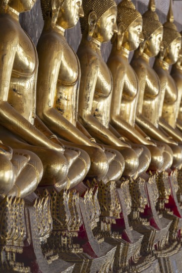 Gilded Buddha statues (Bhumispara mudra: Buddha Gautama at the moment of enlightenment), Wat Suthat Thepwararam, Royal Temple, Phra Nakhon, Bangkok, Thailand