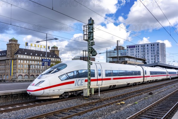 ICE train on track 2 in Essen main station, view of the city center, Handelshof building with Essen lettering, North Rhine-Westphalia, Germany