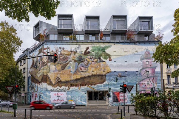 The Bilker Bunker, former air raid shelter from 1944, is a listed building, used as a cultural institution since 2023, exhibitions, concerts, events, gastronomy, mural time travelers, on the roof there are 5 cubes with apartments, private property, conversion of civil protection areas, Düsseldorf, North Rhine-Westphalia, Germany