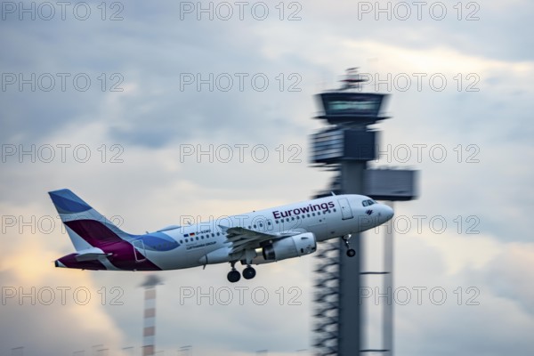 Eurowings Airbus A319 taking off from Düsseldorf Airport, Air Traffic Control Tower, North Rhine-Westphalia, Germany