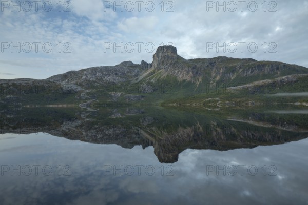 Reflection in Steigtindvatnet in front of the majestic Steigtinden in Norway near Bodø