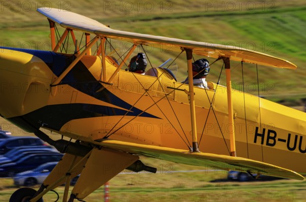 A biplane Bücker Bü 131 Jungmann with the registration HB-UUD during a flight demonstration as part of an air show on Rossfeld in Metzingen-Glems, Baden-Württemberg, Germany, for editorial use only