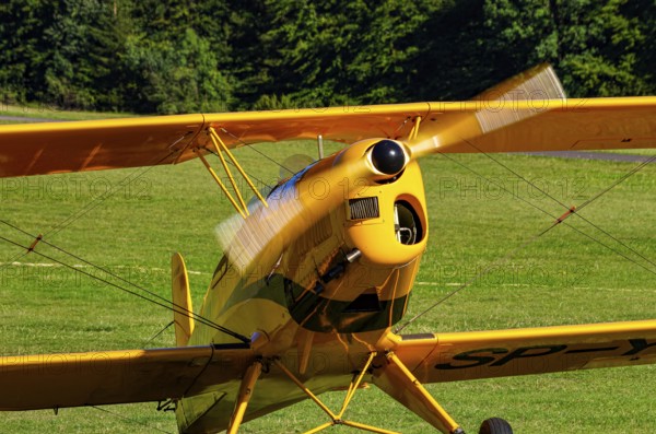 A biplane Bücker Bü 131 Jungmann with registration SP-YPZ during a flight demonstration as part of an air show on Rossfeld in Metzingen-Glems, Baden-Württemberg, Germany, for editorial use only