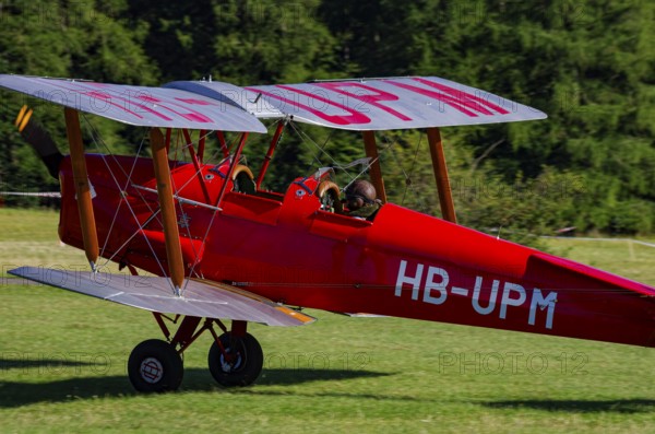 A De Havilland DH.82 Tiger Moth with the registration HB-UPM during a flight demonstration as part of an air show on Rossfeld in Metzingen-Glems, Baden-Württemberg, Germany, for editorial use only