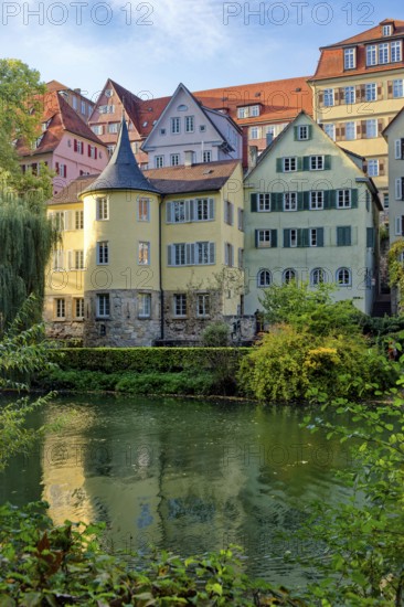 Hölderlin Tower, the poet Johann Christian Friedrich Hölderlin lived in the tower room, historic houses on the Neckar front, the Neckar river with poking and water reflection, old town of Tübingen, Baden-Württemberg, Germany