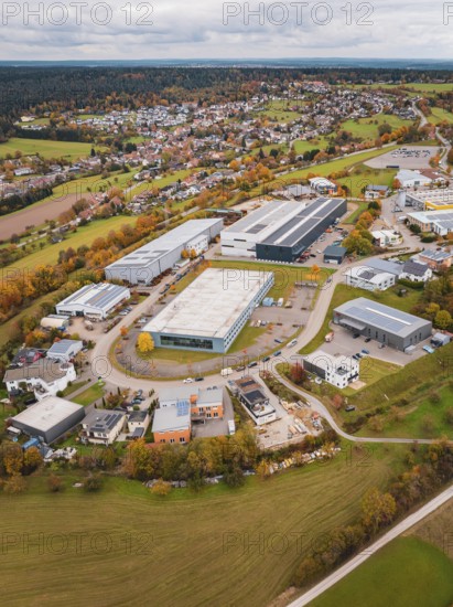 Industrial landscape with autumnal fields and buildings seen from a bird's eye view, Dornstetten, Freudenstadt district, Germany