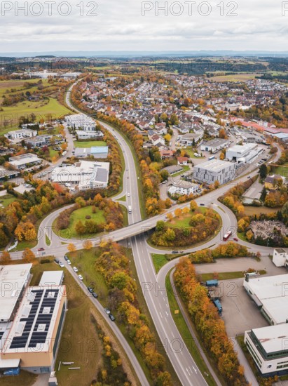 Urban area with roads and buildings in autumn colors seen from a bird's eye view, Dornstetten, Freudenstadt district, Germany