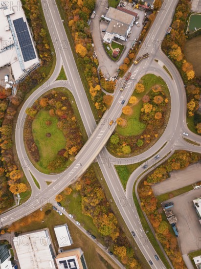 Complex road structure with roundabout and autumn colors, seen from a bird's eye view, Dornstetten, Freudenstadt district, Germany