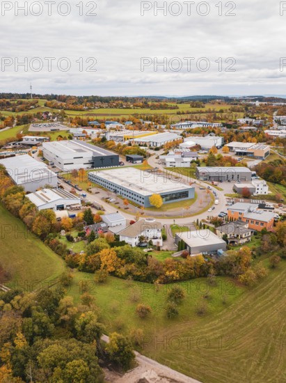 Large industrial area in autumn surroundings, bird's-eye view of houses and fields, Dornstetten, Freudenstadt district, Germany