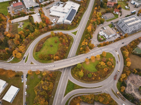 Complex road network with autumn trees and modern infrastructure viewed from above, Dornstetten, Freudenstadt district, Germany