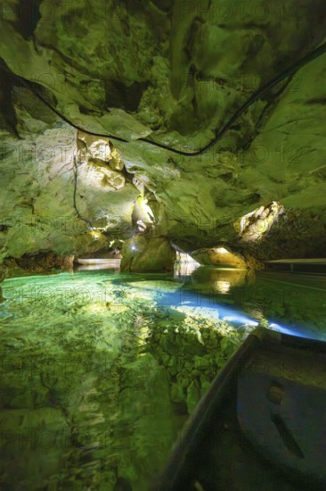 View of a cave with clear green water and natural rock formations, Wimsener Höhle, Hayingen, Germany