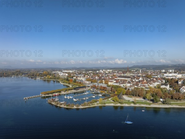 Aerial view of the town of Radolfzell on Lake Constance with the Wäschbruckhafen, harbour pier and concert sail, on the horizon the Hegauberge, district of Konstanz, Baden-Württemberg, Germany