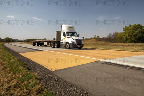 Blue Earth, Minnesota - A 'Golden Stripe' of yellow pavement marks the spot where Interstate 90 was completed in 1978. Stretching 3, 099 miles from Boston to Seattle, I-90 is the longest U.S. Interstate highway. 'Golden Stripe' recalls the 1869 'Golden Spike' of the first transcontinental railroad
