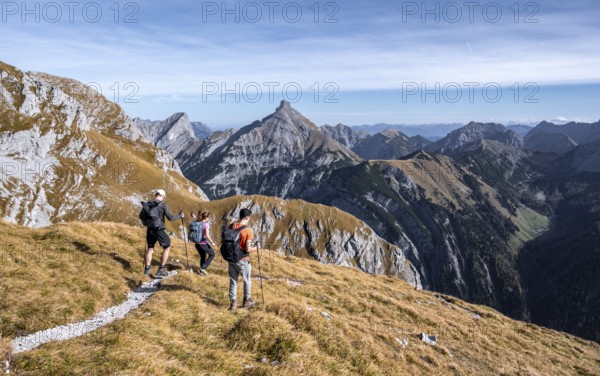 Three hikers on hiking trail, hiking to Gamsjoch, eastern Karwendel, Tyrol, Austria