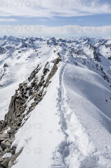 Narrow mountain ridge in winter, summit of Piz Grialetsch, view of mountain panorama with snow, Bündner Haute Route, Albula Alps, Rhaetian Alps, Grisons, Switzerland