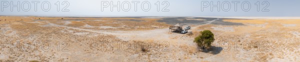 Panorama, off-road cars on a salt pan, dry landscape, Botswana